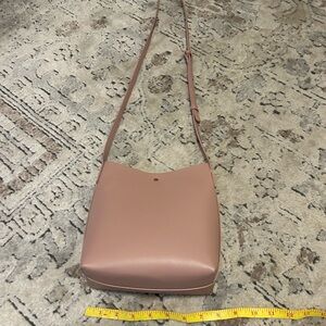 Woman’s pink cross body purse